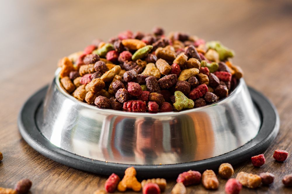 Dry,Colorful,Cat,Food,In,Metal,Bowl,On,Wooden,Background